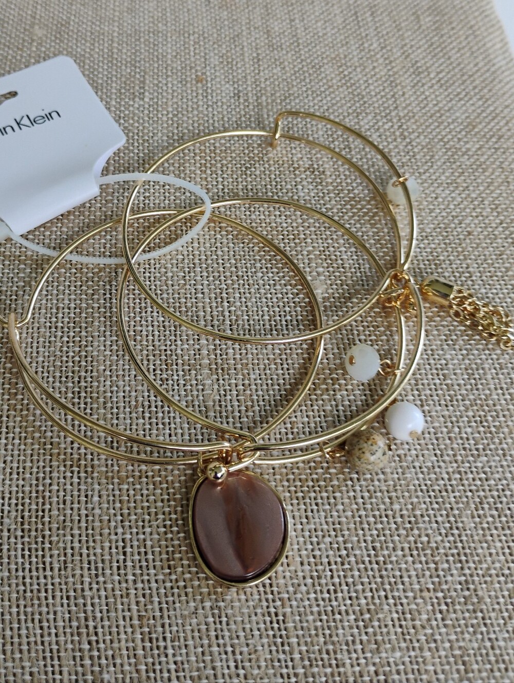NWT Calvin Klein Gold Tone Charm Bangle Set with Brown Stone and White Beads